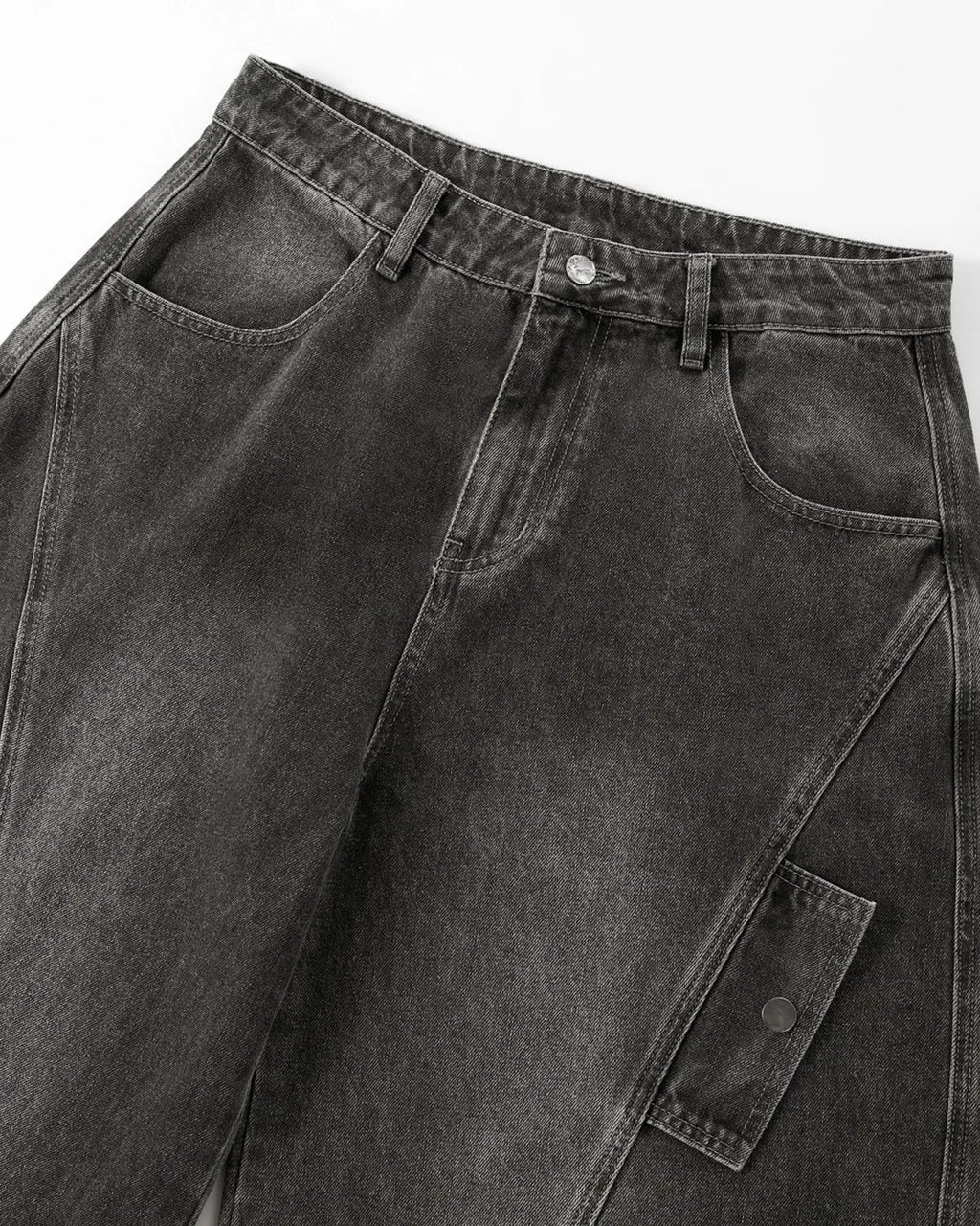 Black distressed washed cargo barrel jeans by Flation Streetwear, featuring a relaxed fit and rugged denim style.