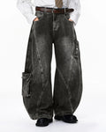 Black distressed washed cargo barrel jeans by Flation Streetwear, featuring a relaxed fit and rugged, worn-in style.