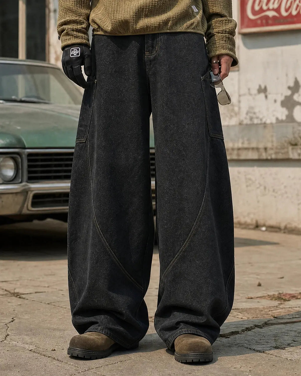 Black Flation Super Raw Barrel Jeans by Flation streetwear, featuring a relaxed fit and raw hem details.