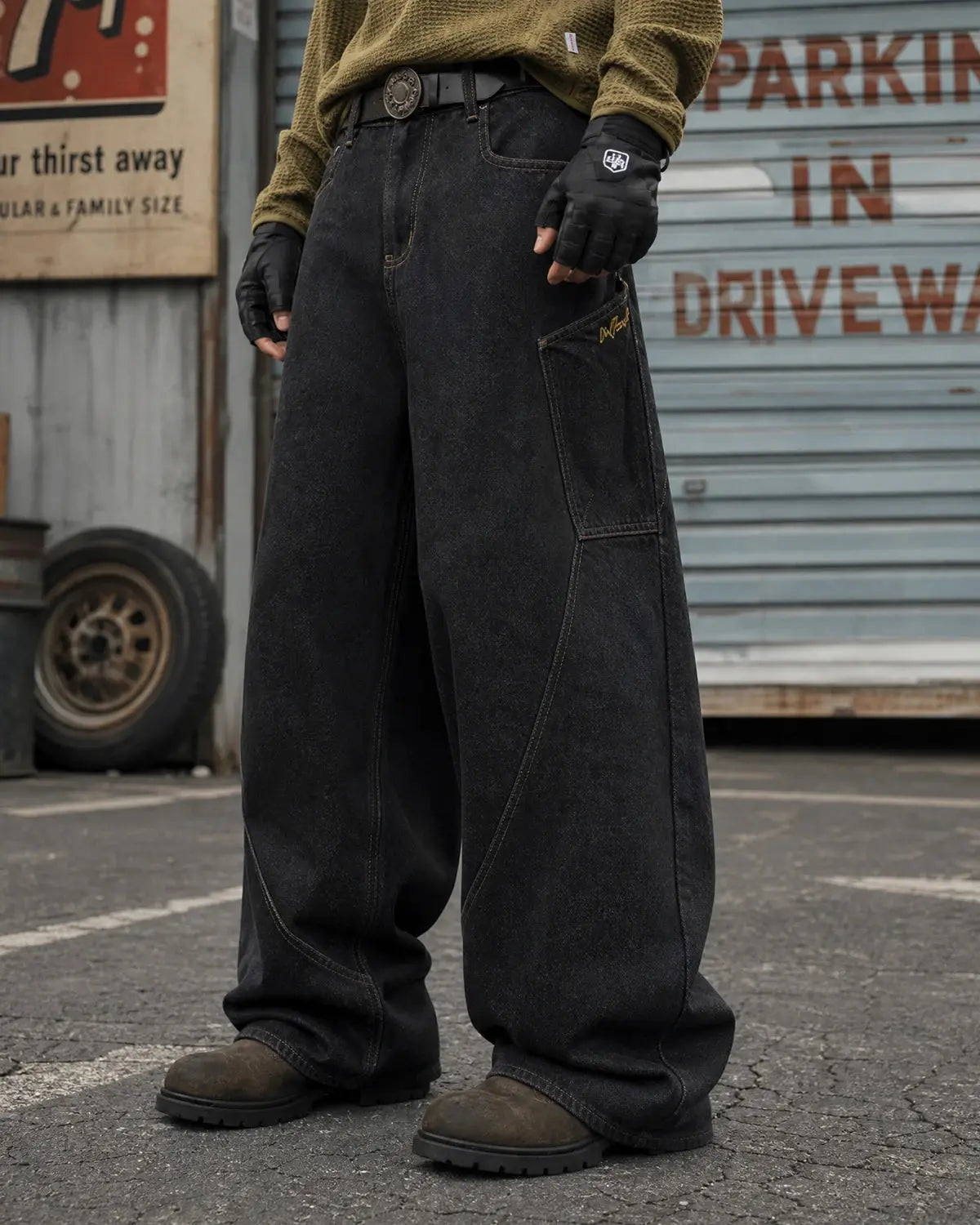 Black Flation Super Raw Barrel Jeans from Flation Streetwear, showing the relaxed fit and raw denim texture.
