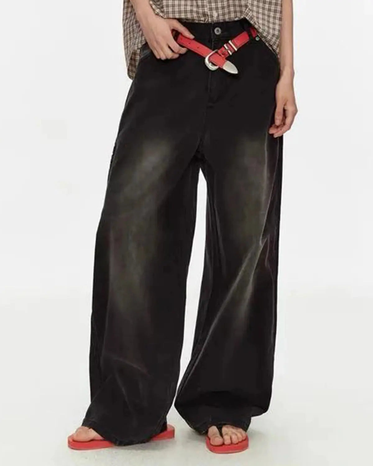 Retro washed wide-leg jeans from Flation Streetwear, showing the relaxed fit and faded denim texture.