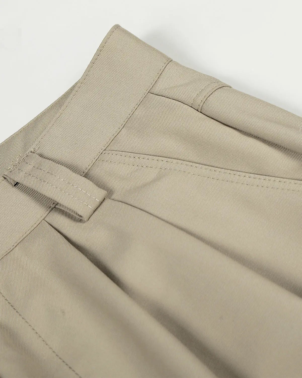 Wide-leg tailored pants with a rope belt by Flation streetwear, featuring a sleek, modern design and neutral color.