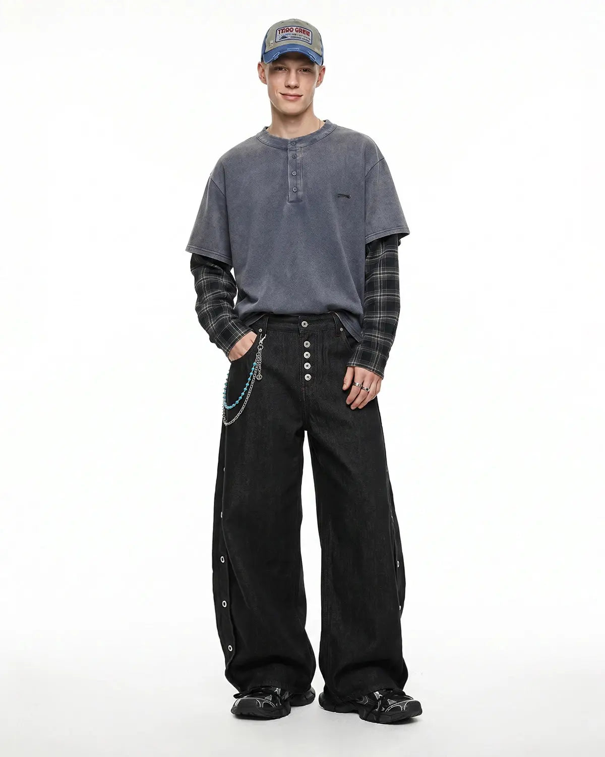 Flation Streetwear barrel jeans featuring side eyelet buttons, casual fit, and distressed denim style.