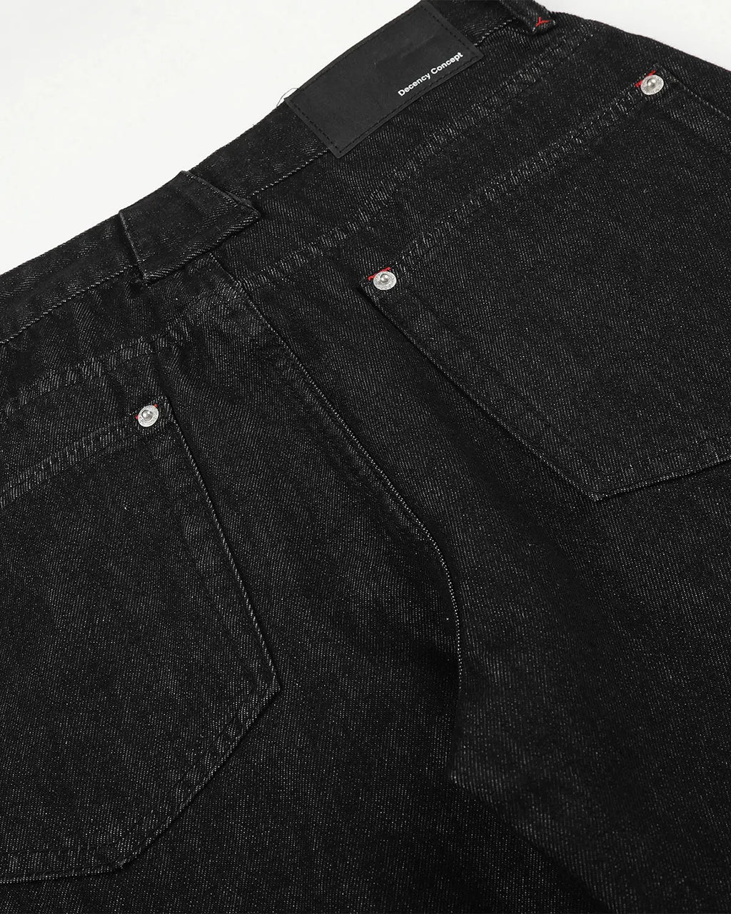 Pair of Flation Streetwear barrel jeans featuring side eyelet buttons and a relaxed fit, shown on a model.