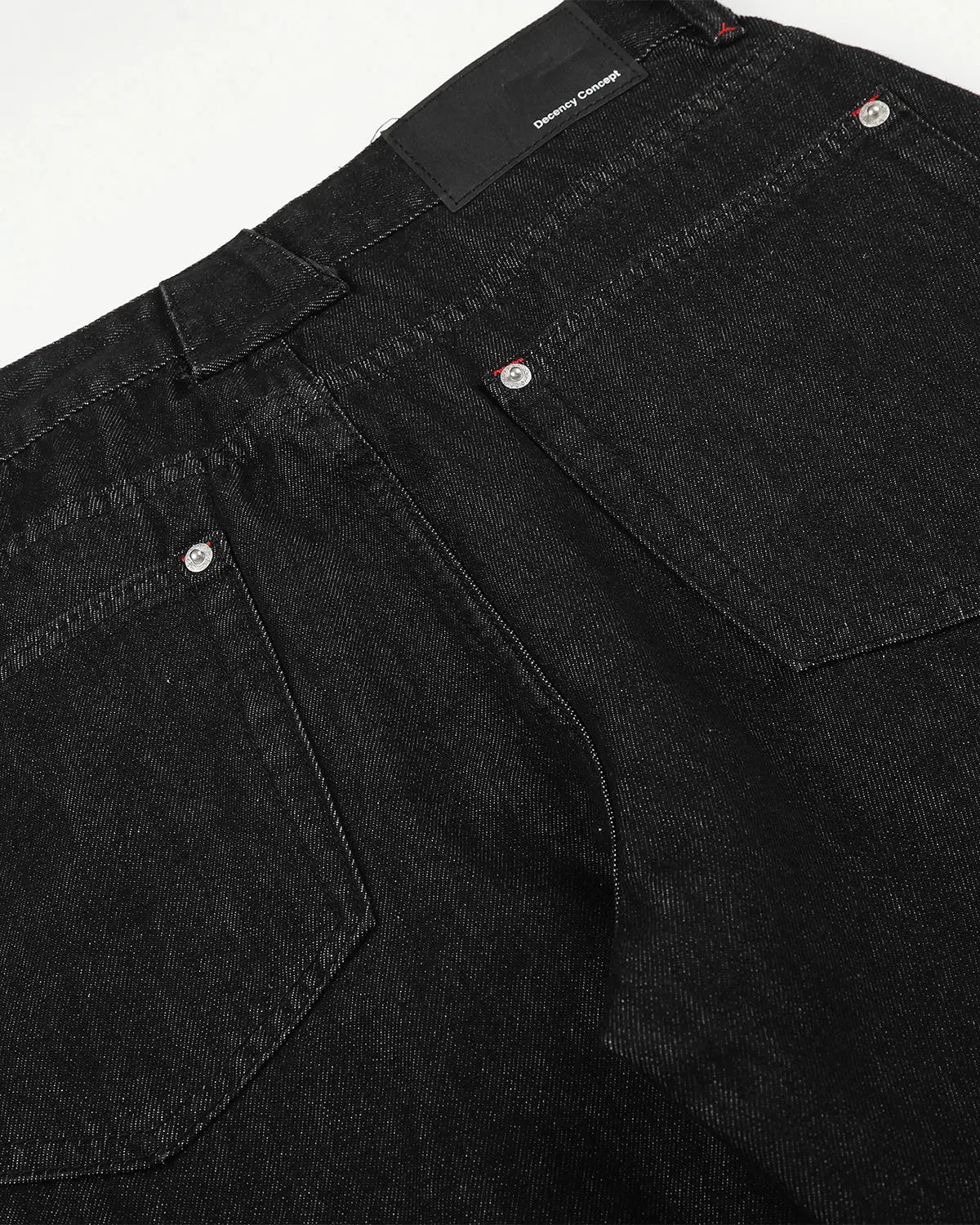 Pair of Flation Streetwear barrel jeans featuring side eyelet buttons and a relaxed fit, shown on a model.
