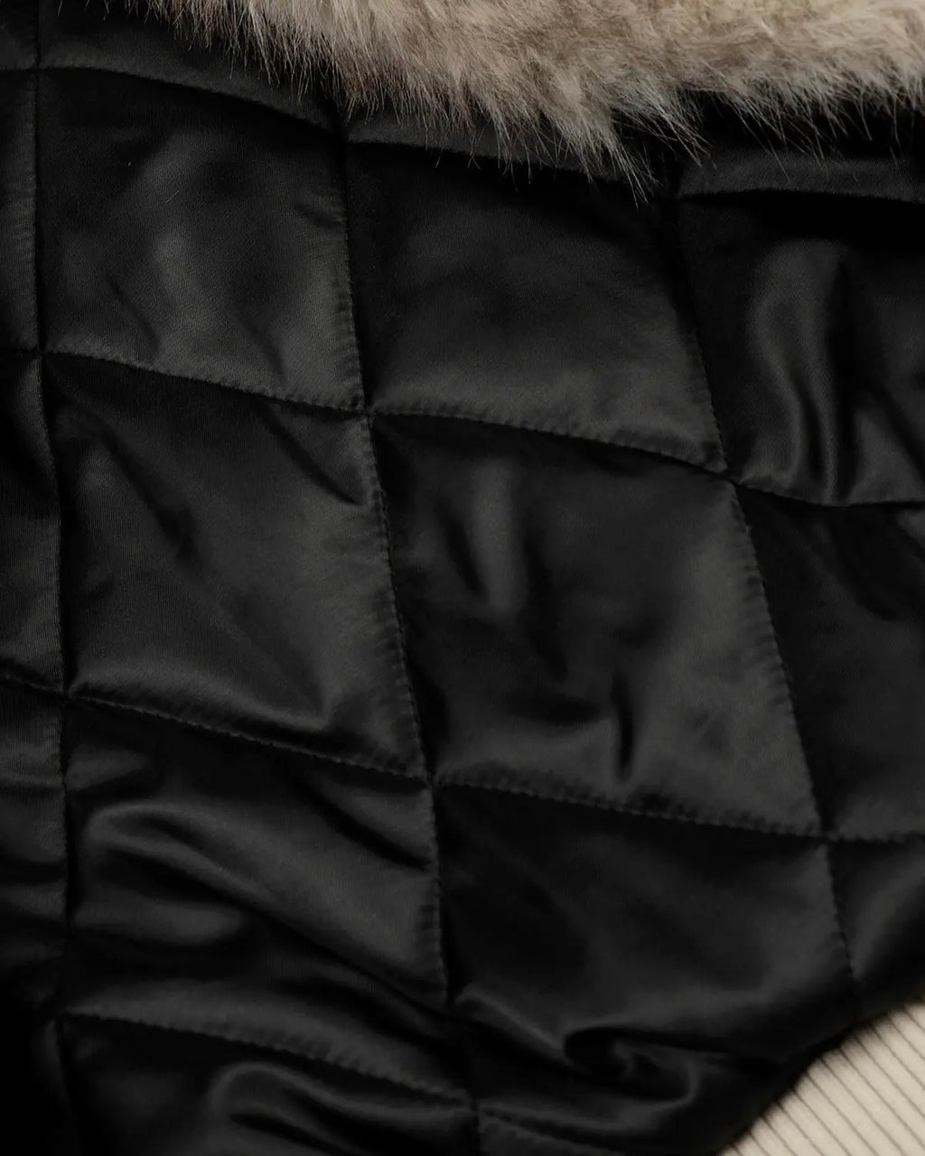 Black Flation Fireman Padded Jacket with slanted clasp, crafted for streetwear style and warmth.