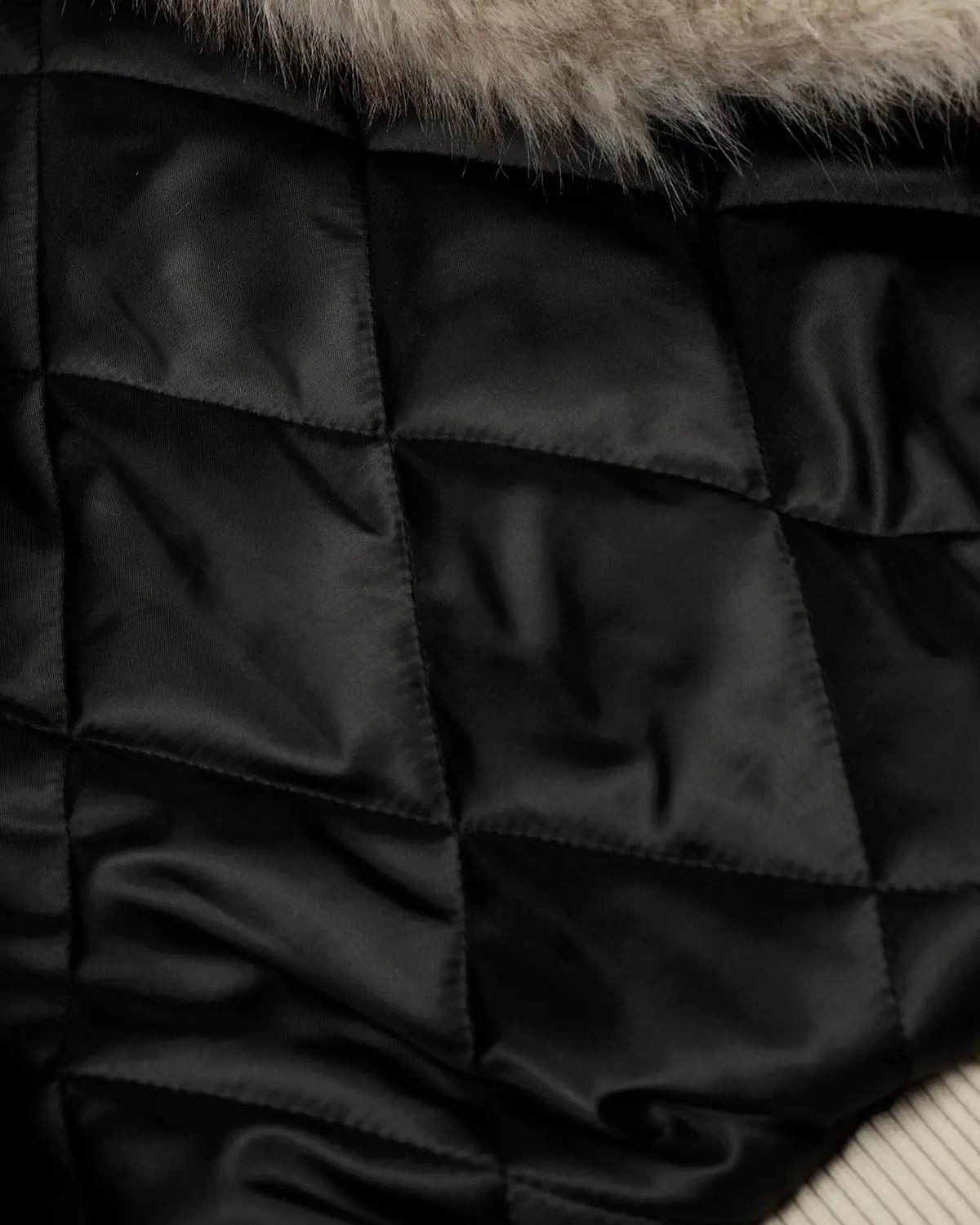 Black Flation Fireman Padded Jacket with slanted clasp, crafted for streetwear style and warmth.