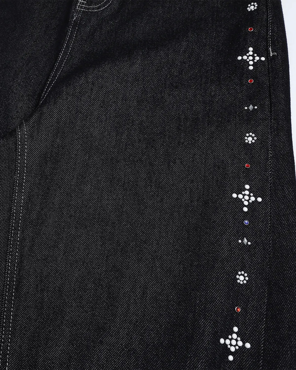 Black baggy denim jeans with studded rhinestones by Flation, featuring a relaxed streetwear style and stylish embellishments.