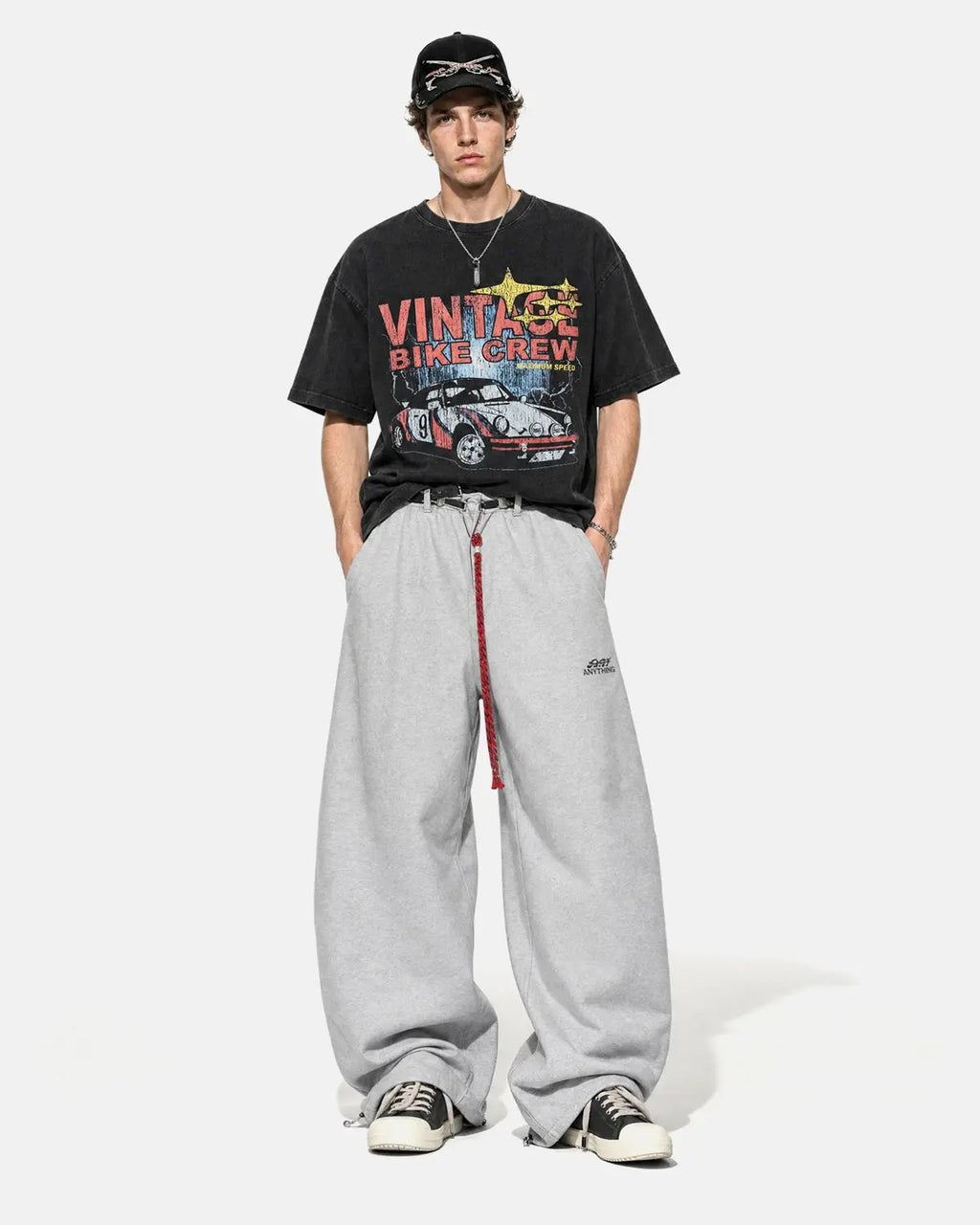Black vintage graphic snow-washed T-shirt by Flation Streetwear featuring bold print and relaxed fit.