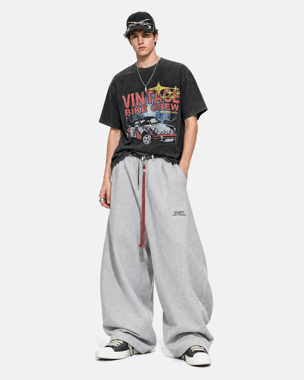 Black vintage graphic snow-washed T-shirt from Flation Streetwear featuring bold retro artwork and a relaxed fit.