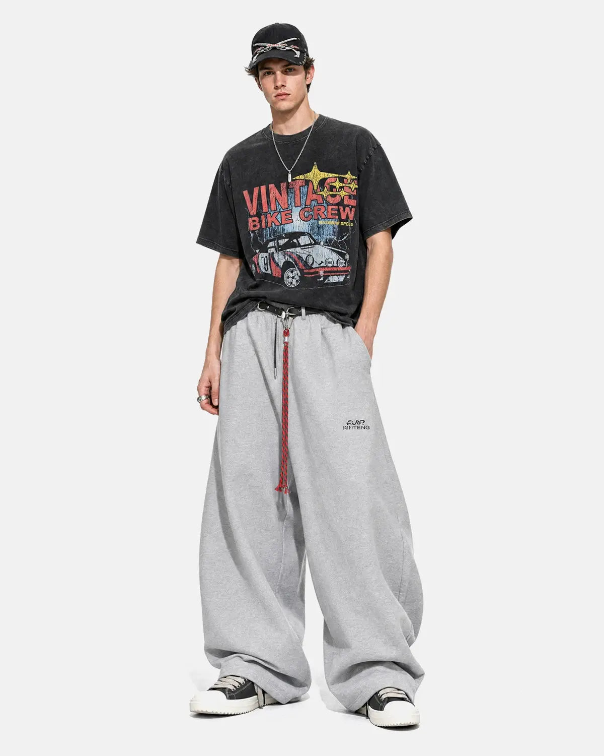 Black vintage graphic snow-washed T-shirt from Flation Streetwear featuring bold retro artwork and a relaxed fit.