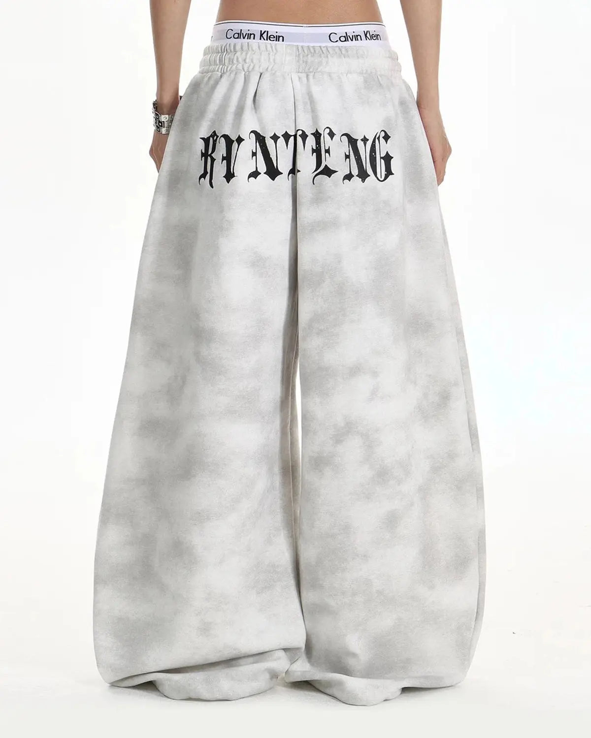 Black washed Cross Barrel sweatpants by Flation Streetwear, featuring relaxed fit and stylish design with side pockets.