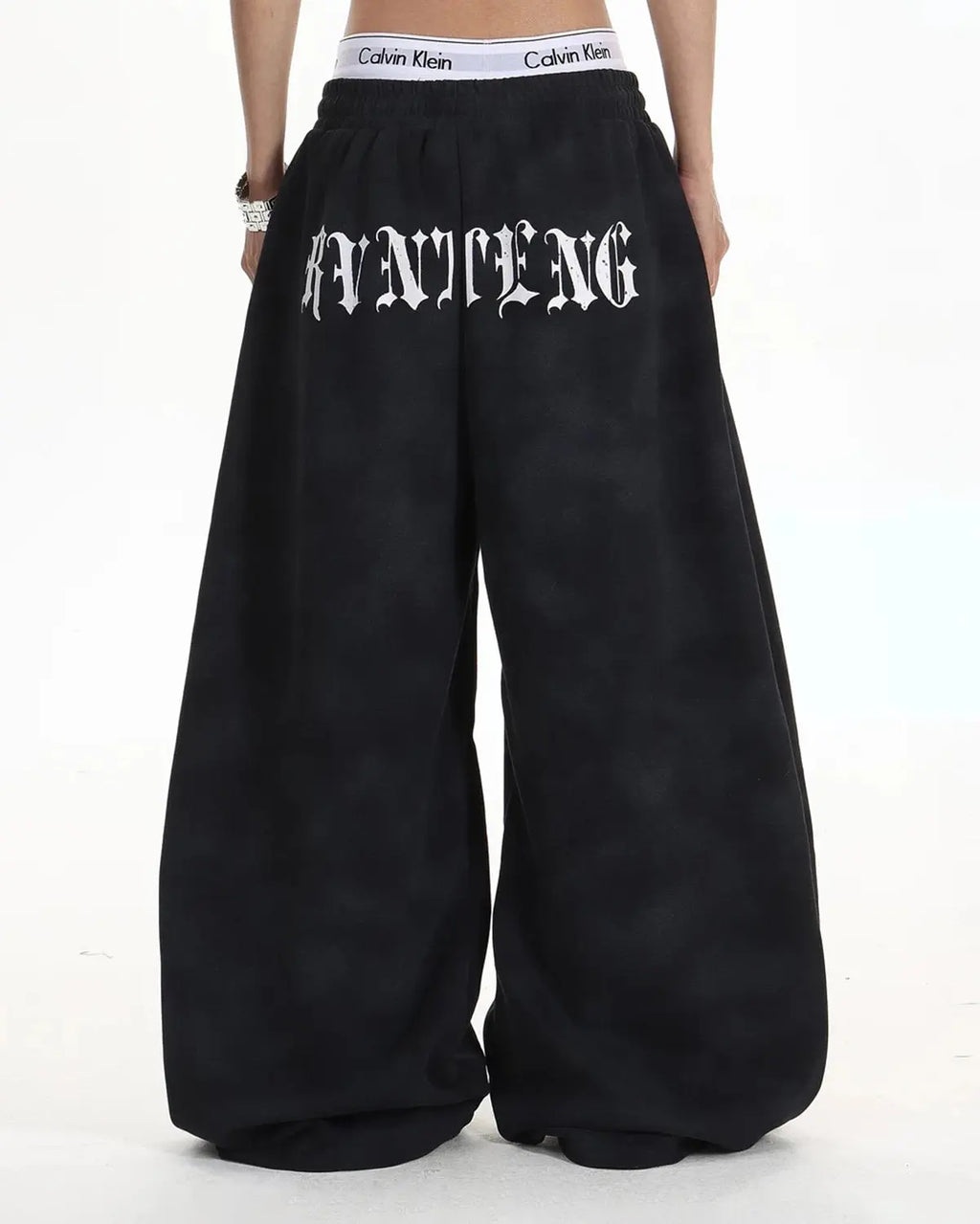 Black washed cross barrel sweatpants by Flation Streetwear, featuring a relaxed fit and stylish design in the image.