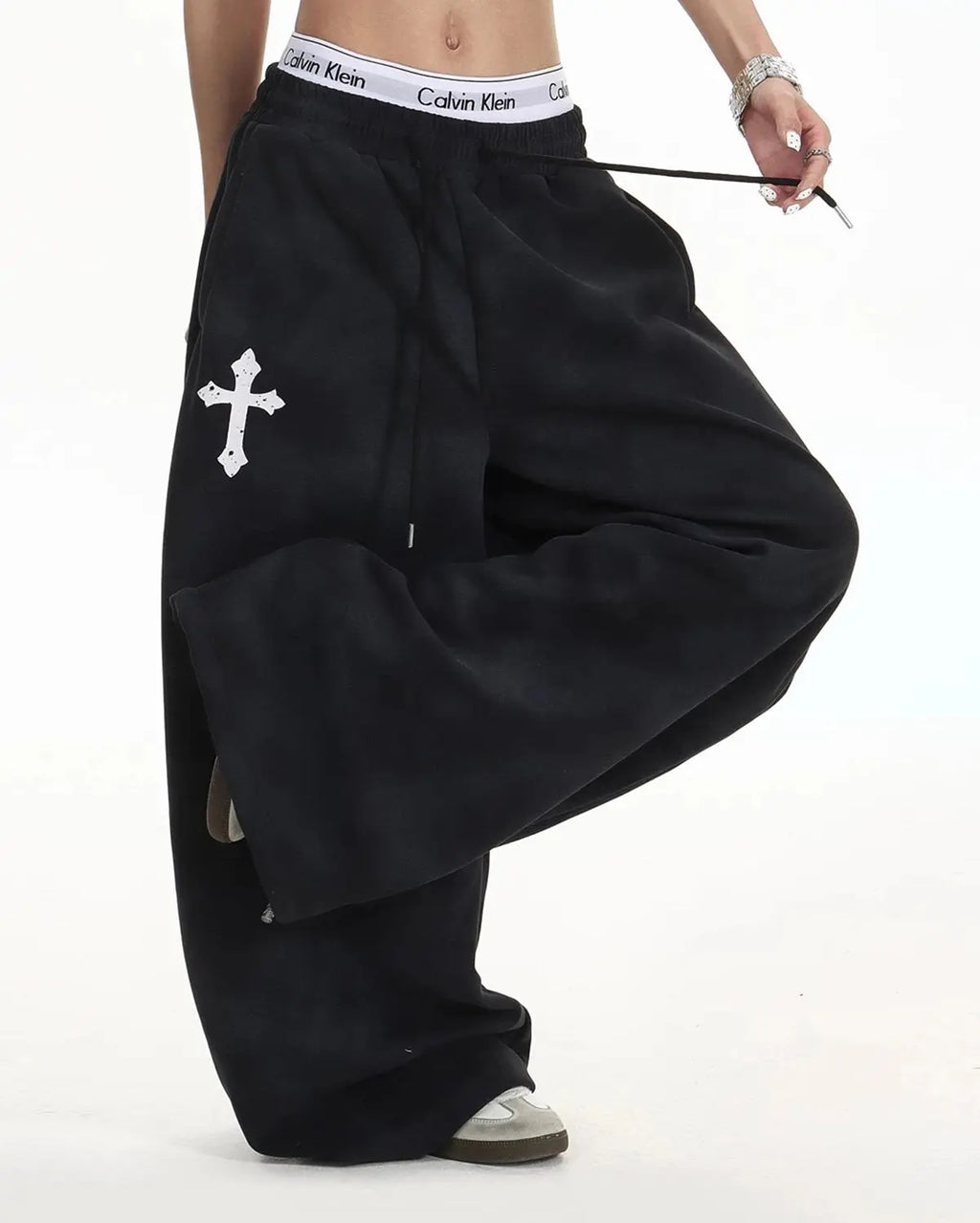 Black washed Cross Barrel sweatpants by Flation Streetwear, featuring relaxed fit and stylish cross detail on the legs.