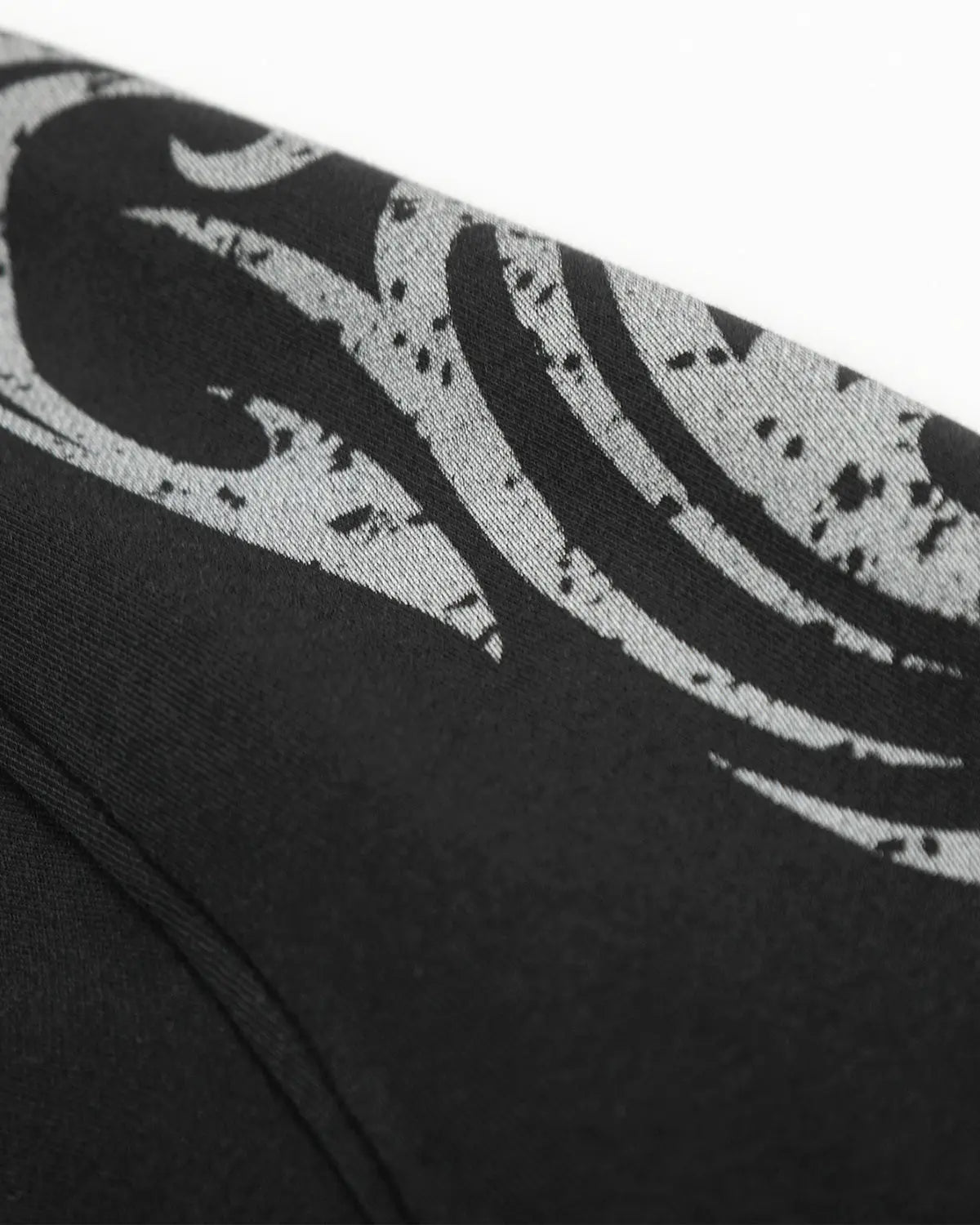 Black washed distressed barrel sweatpants by Flation, featuring relaxed fit and streetwear style with faded detailing.
