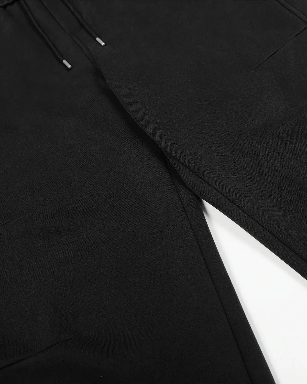 Black washed distressed barrel sweatpants by Flation Streetwear with a relaxed fit and casual style.
