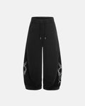 Black washed distressed barrel sweatpants by Flation Streetwear with relaxed fit and rugged distressed details.