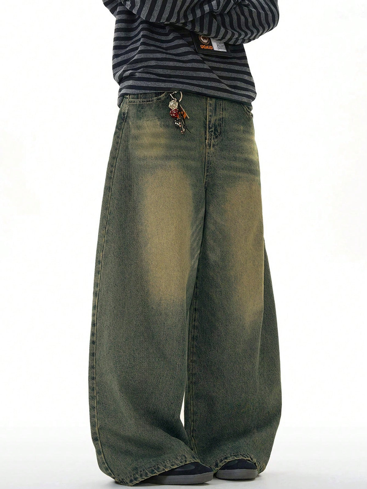 Black Flation wide leg distressed vintage denim jeans with loose fit and relaxed style, shown on a model.