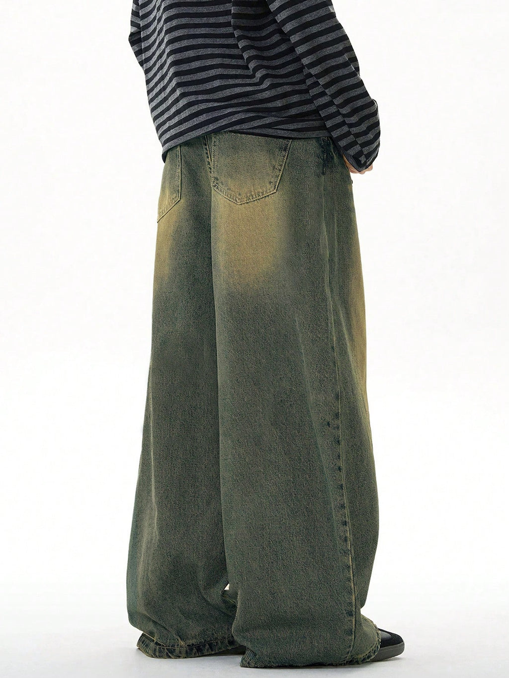 Black Flation wide leg loose fit distressed vintage denim jeans shown on model, showcasing relaxed fit and rugged style.