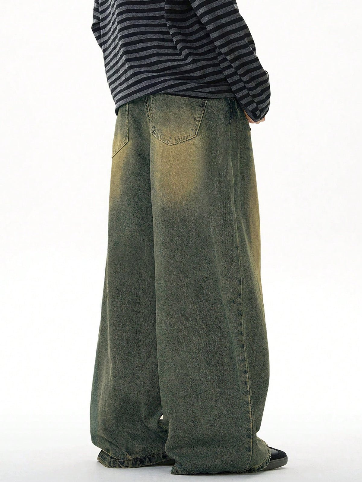 Black Flation wide leg loose fit distressed vintage denim jeans shown on model, showcasing relaxed fit and rugged style.