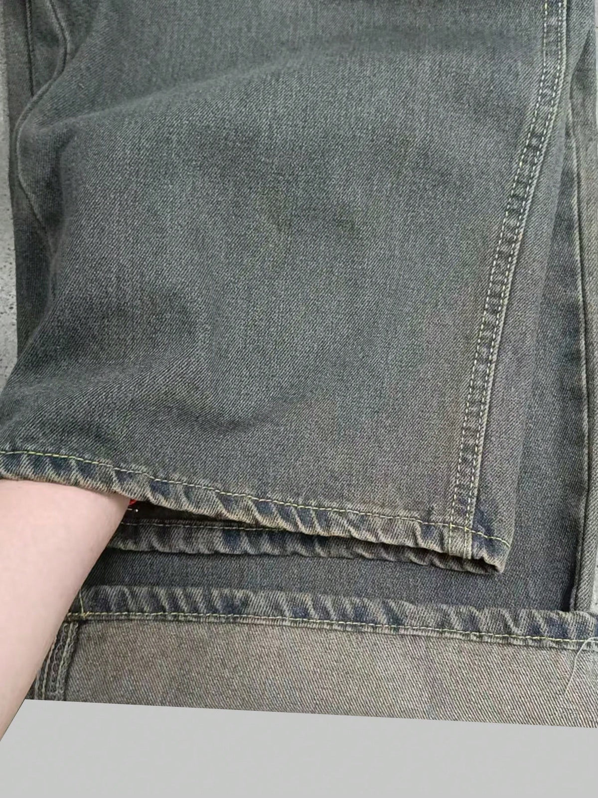 Black Flation wide-leg loose fit distressed vintage denim jeans displayed on a model.