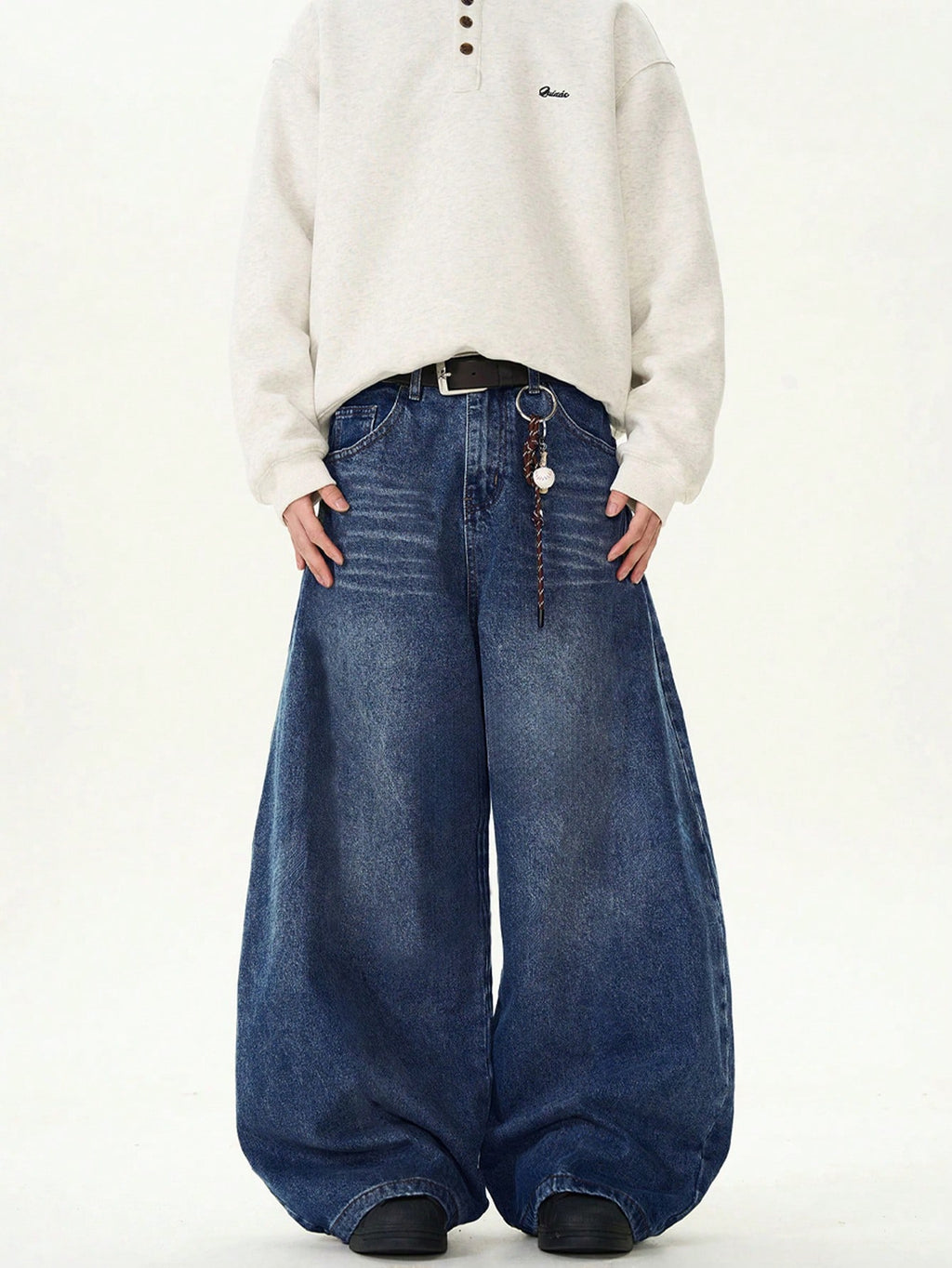 Black Flation wide-leg loose fit distressed vintage denim jeans displayed on a model.