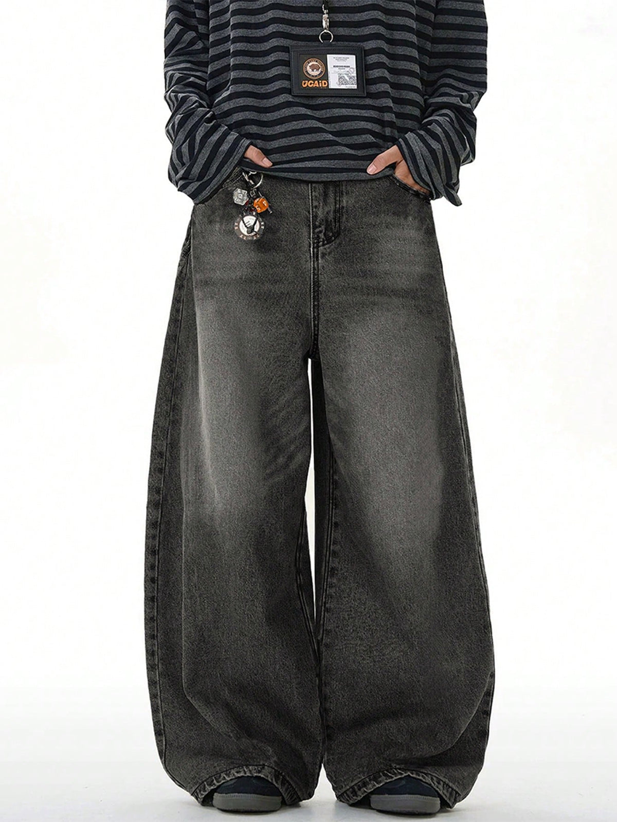 Black Flation wide-leg loose fit distressed vintage denim jeans displayed on a model, showcasing relaxed fit and distressed detailing.
