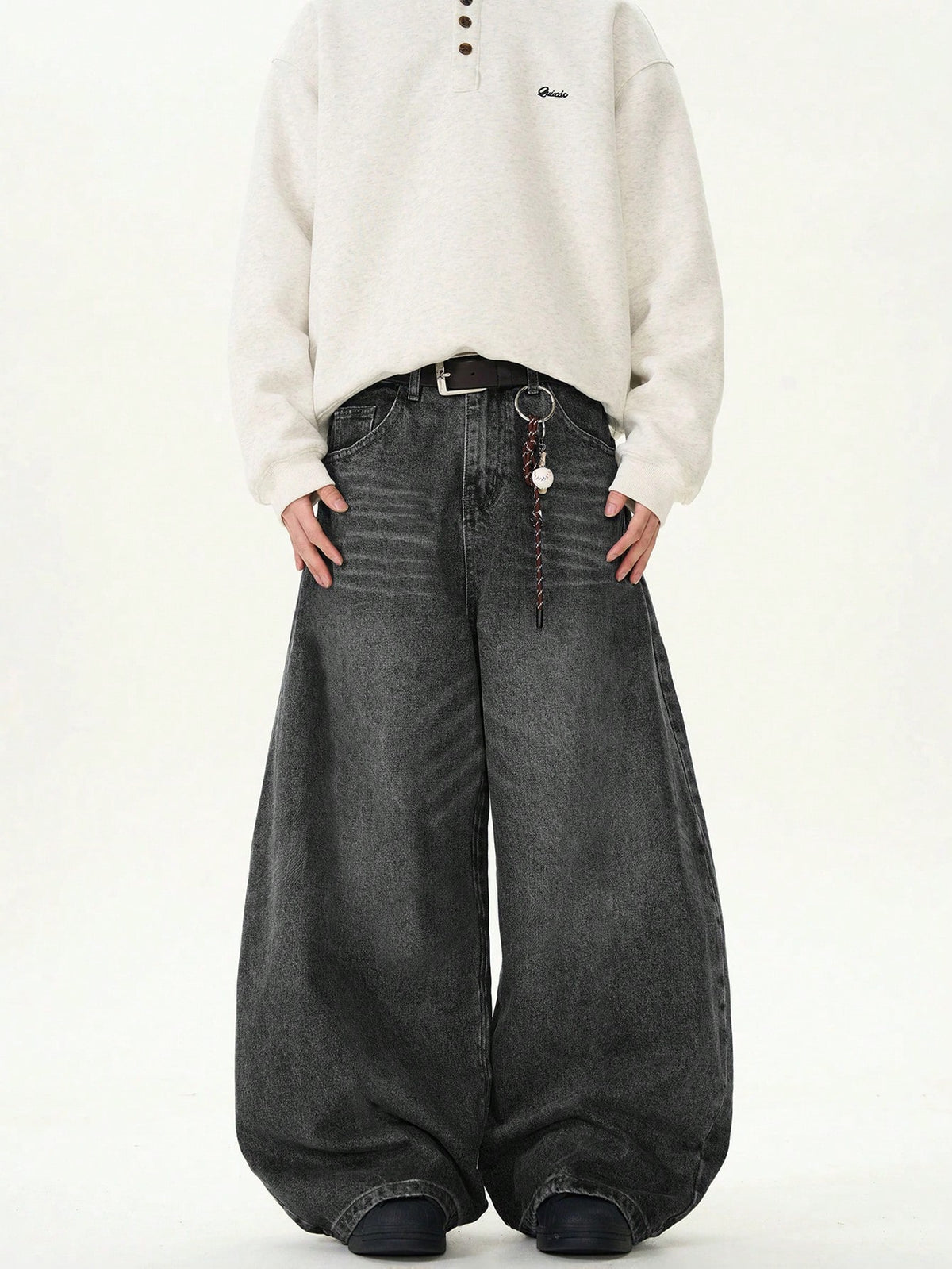 Black Flation wide leg loose fit distressed vintage denim jeans, showing relaxed fit and distressed detailing.