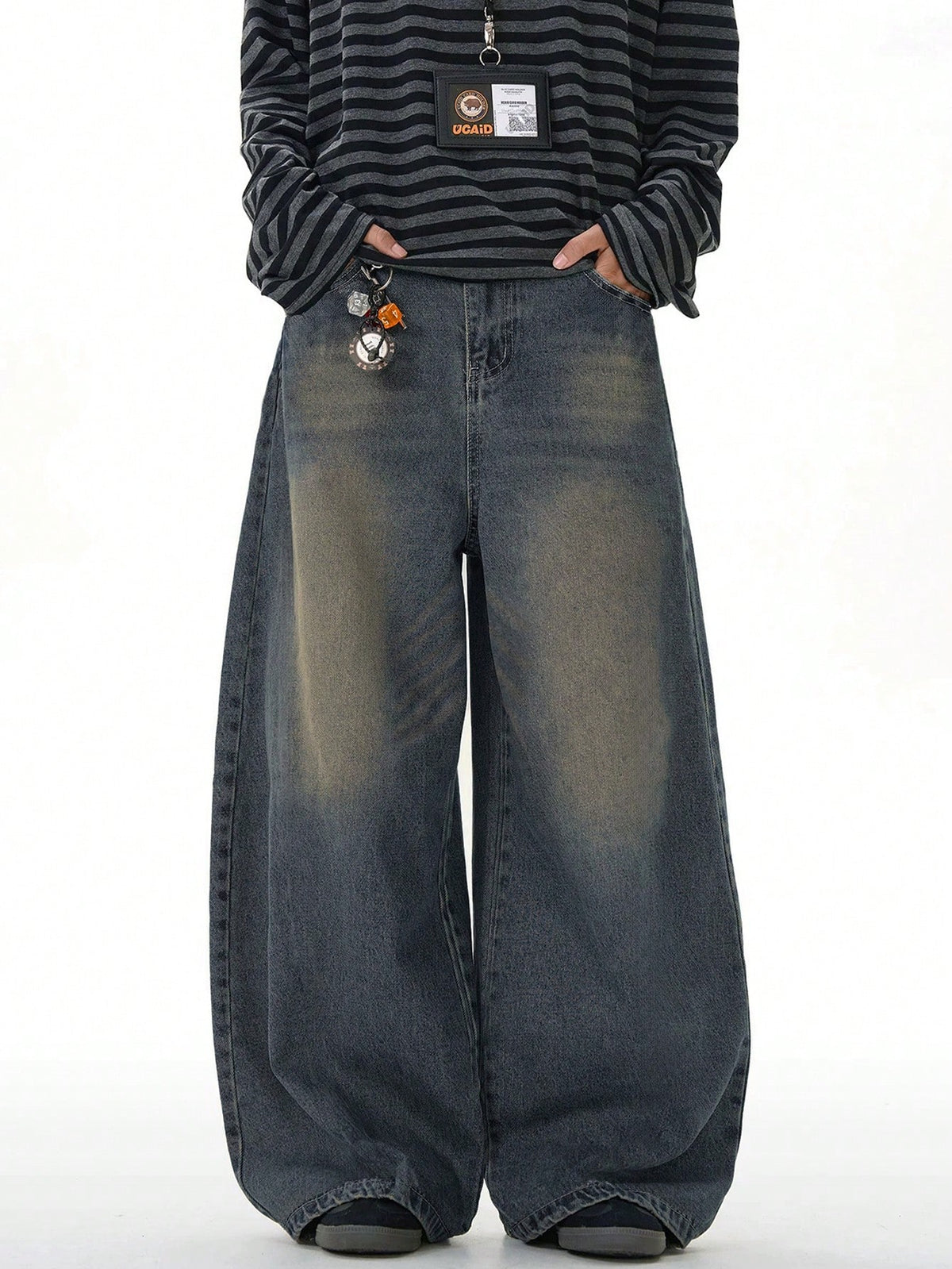 Black Flation wide-leg distressed vintage denim jeans with loose fit, showcasing relaxed style and distressed details.