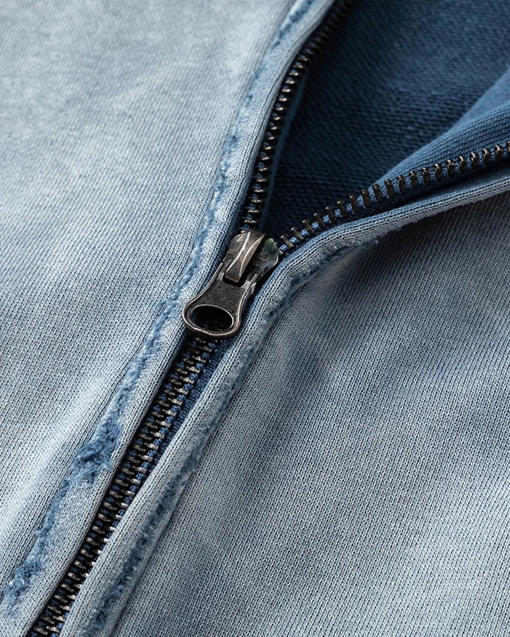 Blue distressed acid wash zip-up hoodie by Flation Streetwear, featuring a casual fit and front zipper detail.