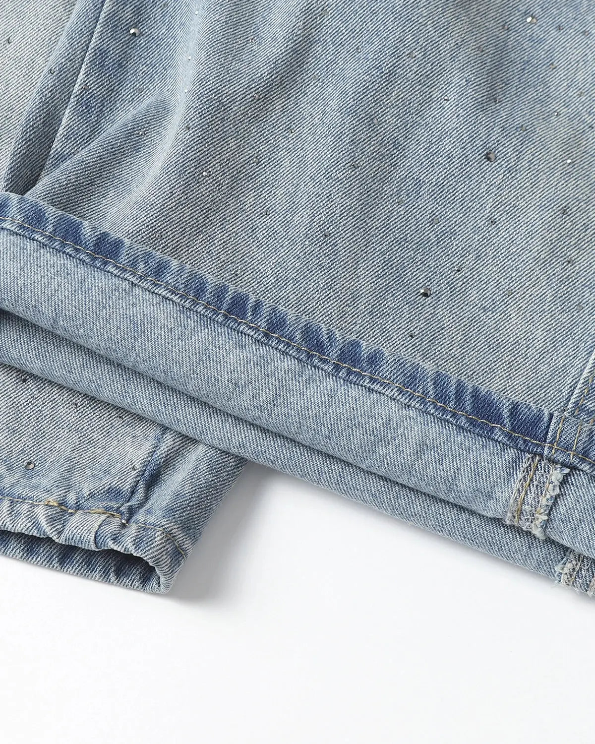 Flation rhinestone baggy barrel jeans with distressed details and wide fit, showcasing the stylish streetwear design and embellishments.