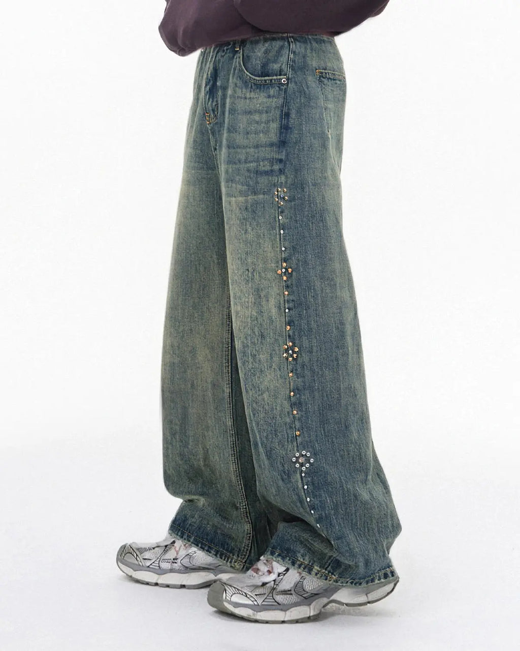 Blue acid wash beaded studded flared baggy jeans by Flation streetwear, featuring a relaxed fit and decorative embellishments.