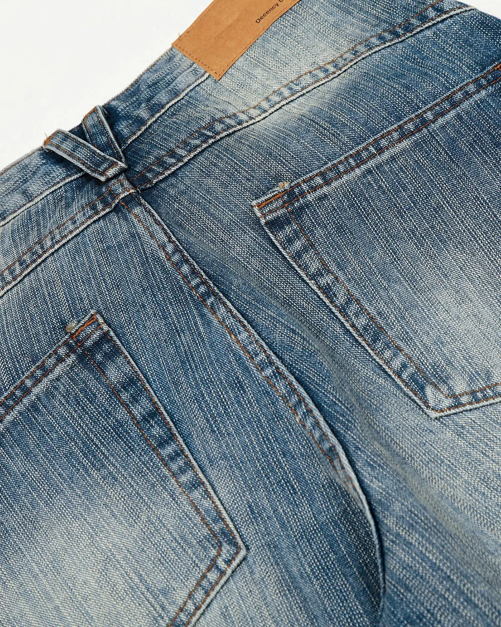 Blue acid wash whisker bamboo weave jeans by Flation Streetwear, showcasing relaxed fit and textured fabric details.