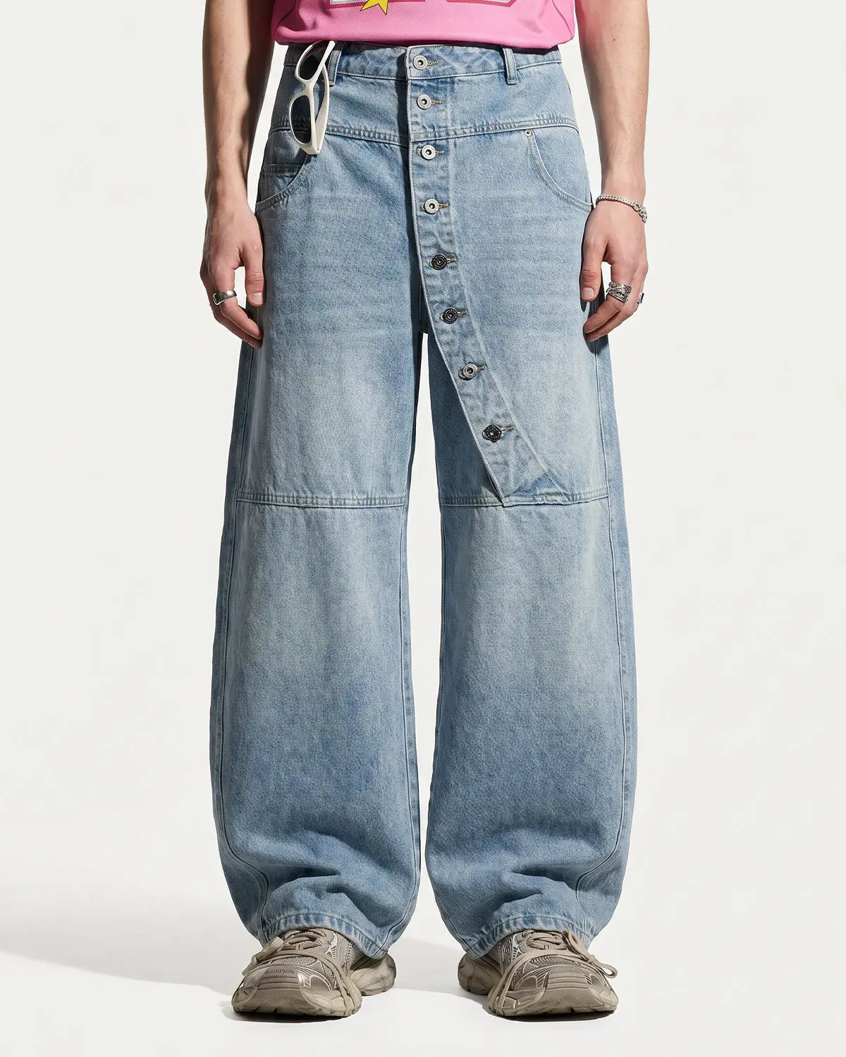 Blue asymmetric button baggy jeans by Flation Streetwear, featuring a relaxed fit and stylish design.