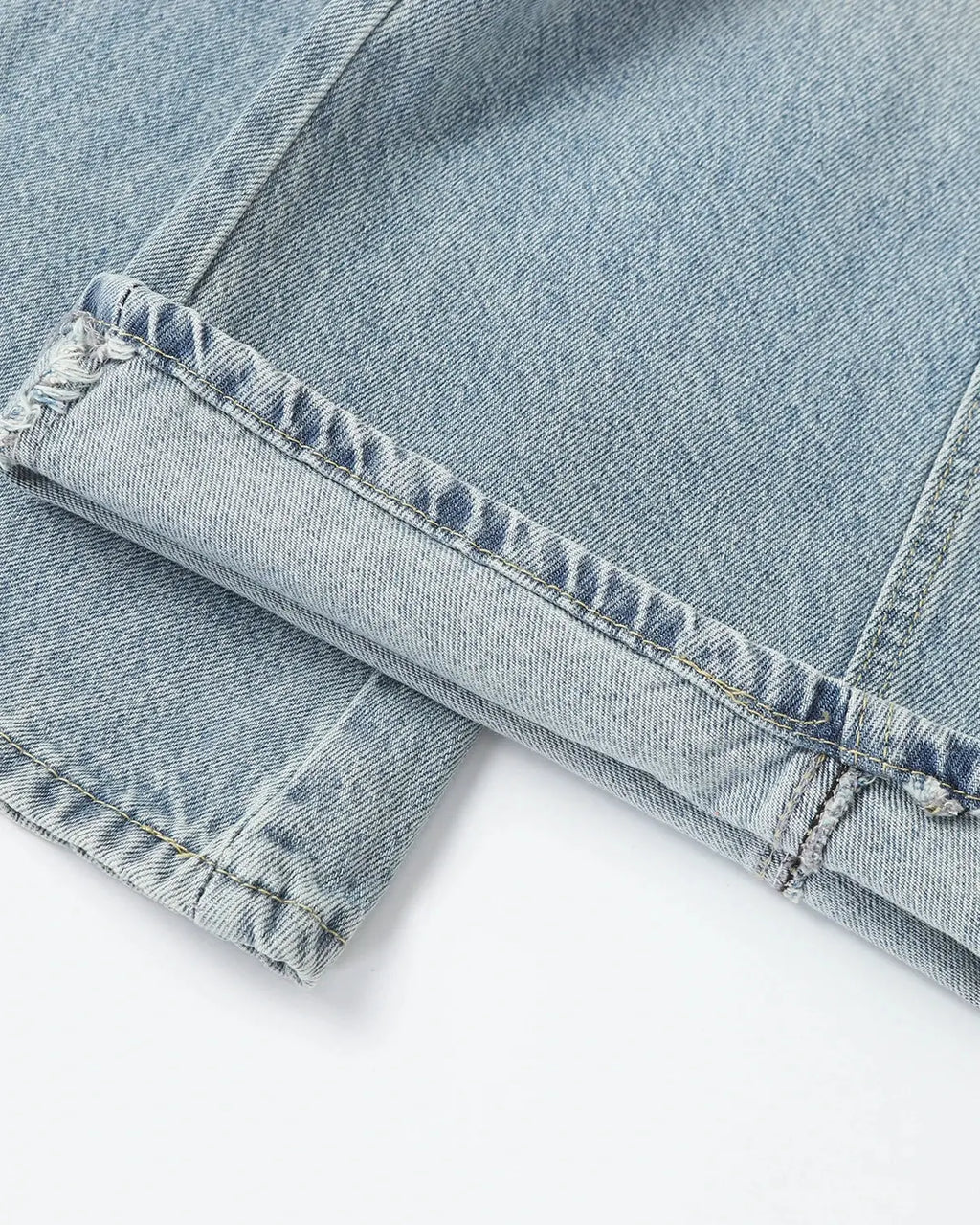 Blue Flation streetwear asymmetric button baggy jeans with relaxed fit and unique design details.