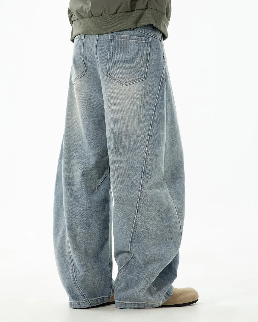 Blue Flation Curved Seam Deconstructed Barrel Jeans with streetwear style and relaxed fit, shown on a model.