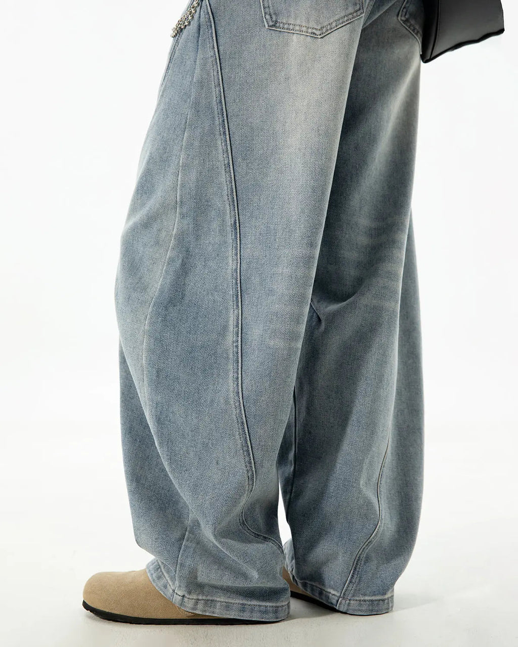 Blue Flation Curved Seam Deconstructed Barrel Jeans with unique seam details and relaxed fit, styled for streetwear fashion.