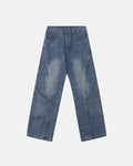 Deconstructed baggy straight-leg jeans by INFLATION, featuring relaxed fit and distressed denim, displayed on a neutral background.