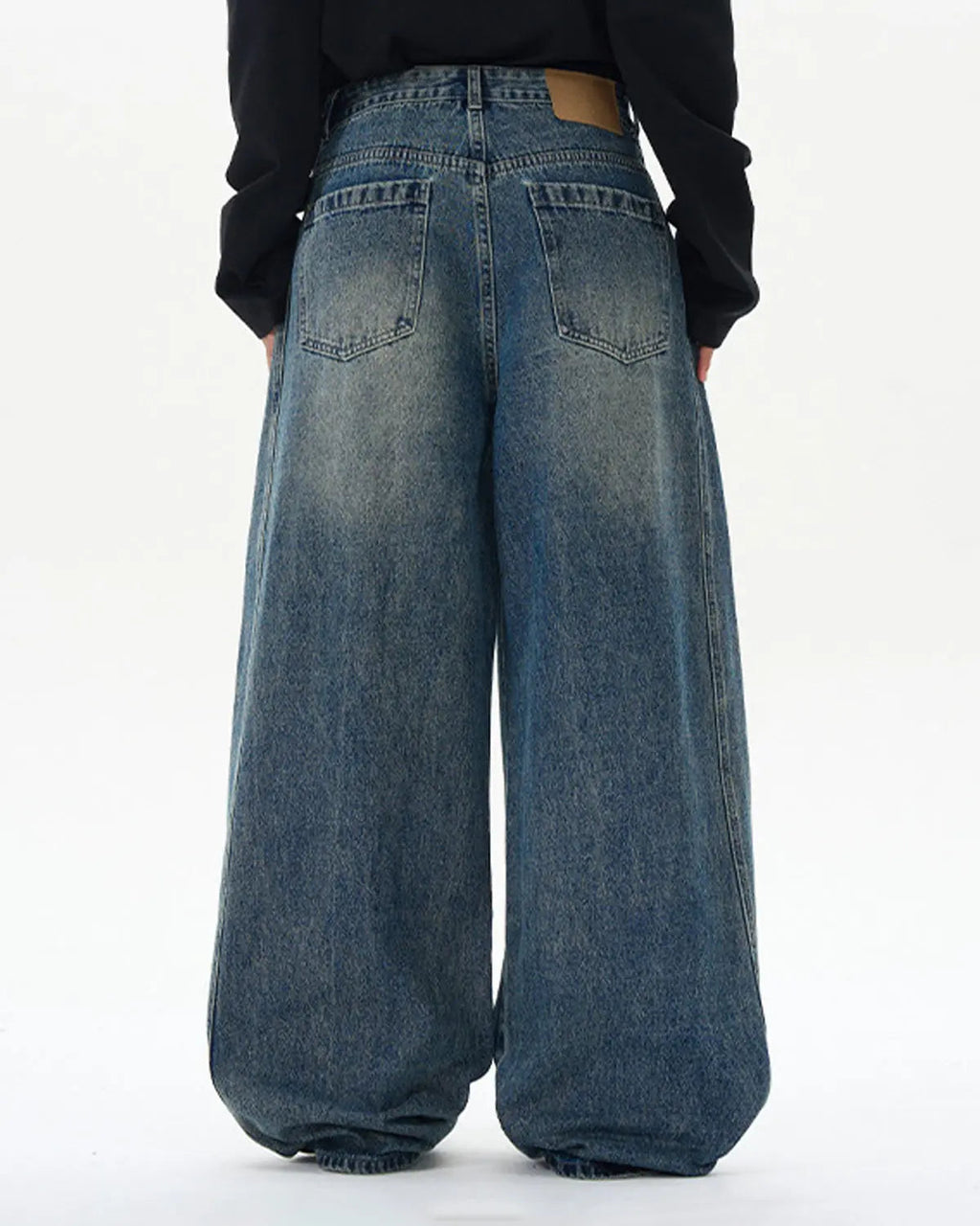 Blue deconstructed washed barrel jeans by Flation Streetwear featuring distressed details and relaxed fit.