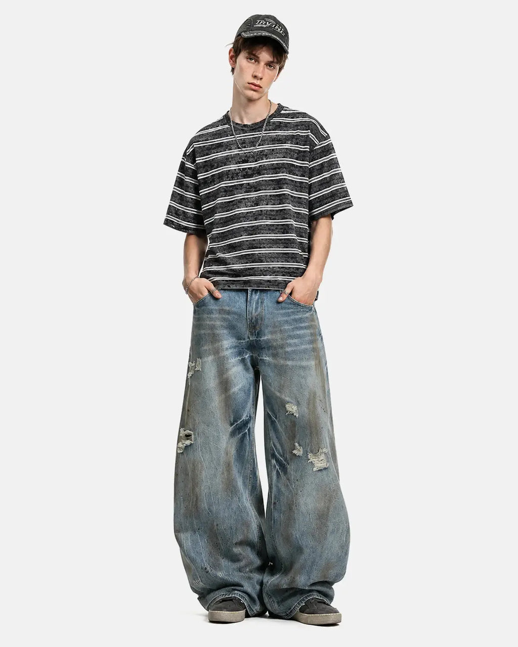 Inflation Dirty Wash Distressed Barrel Jeans with ripped details and faded denim, stylish streetwear for a casual look