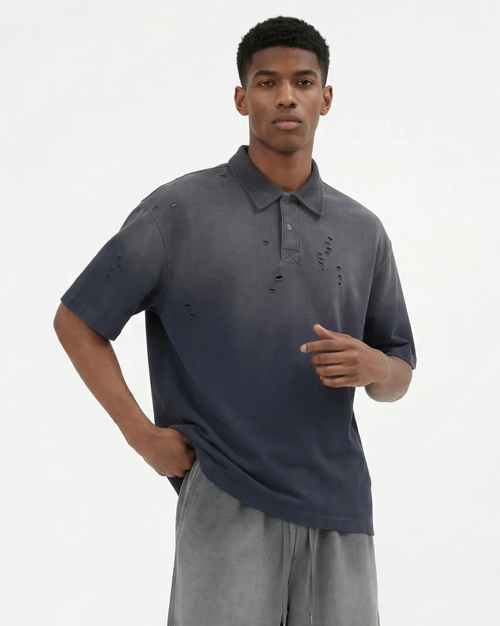 Blue distressed ripped washed polo shirt by Flation streetwear, featuring a casual, worn-in style with a relaxed fit.