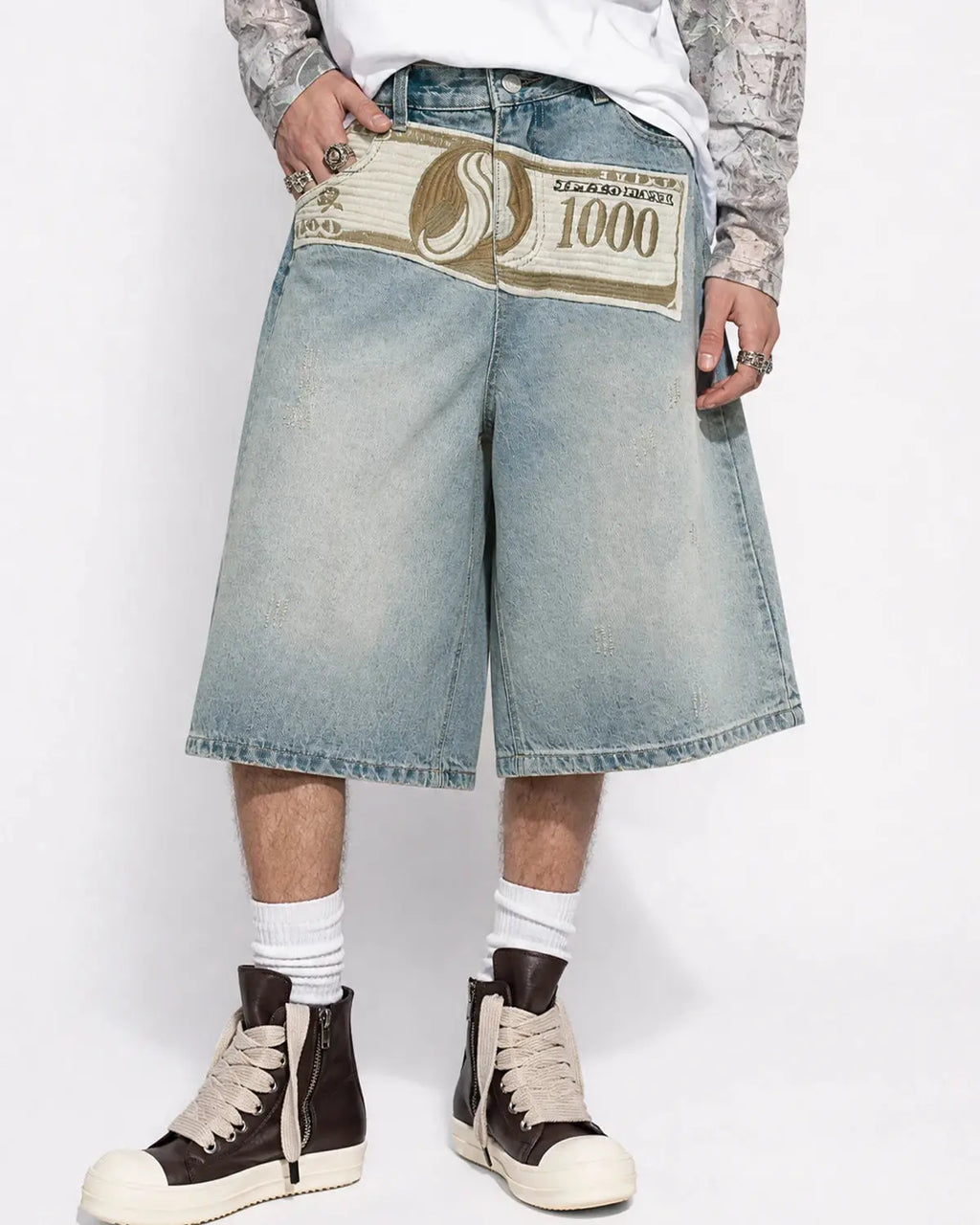 Blue denim Jorts with embroidery patches from Flation Streetwear, featuring distressed details and casual streetwear style.