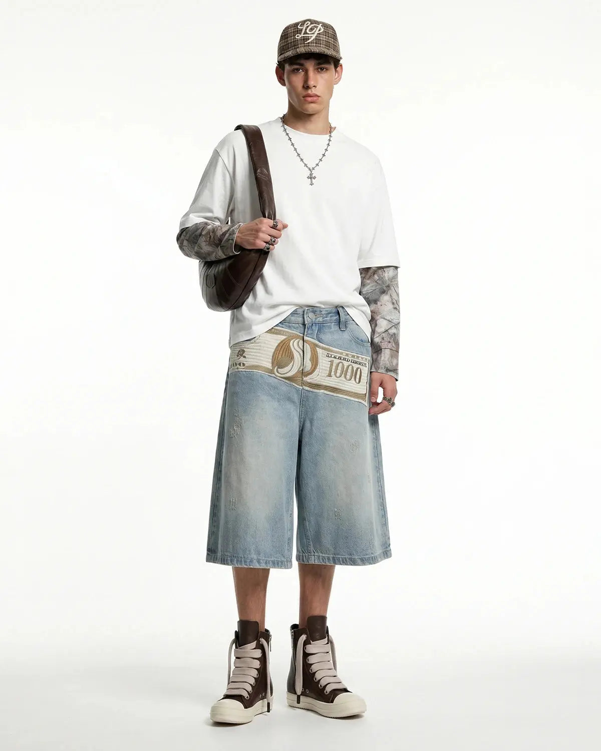 Blue denim Jorts with dollar patch embroidery, casual streetwear shorts by Flation featuring distressed details and frayed hems.