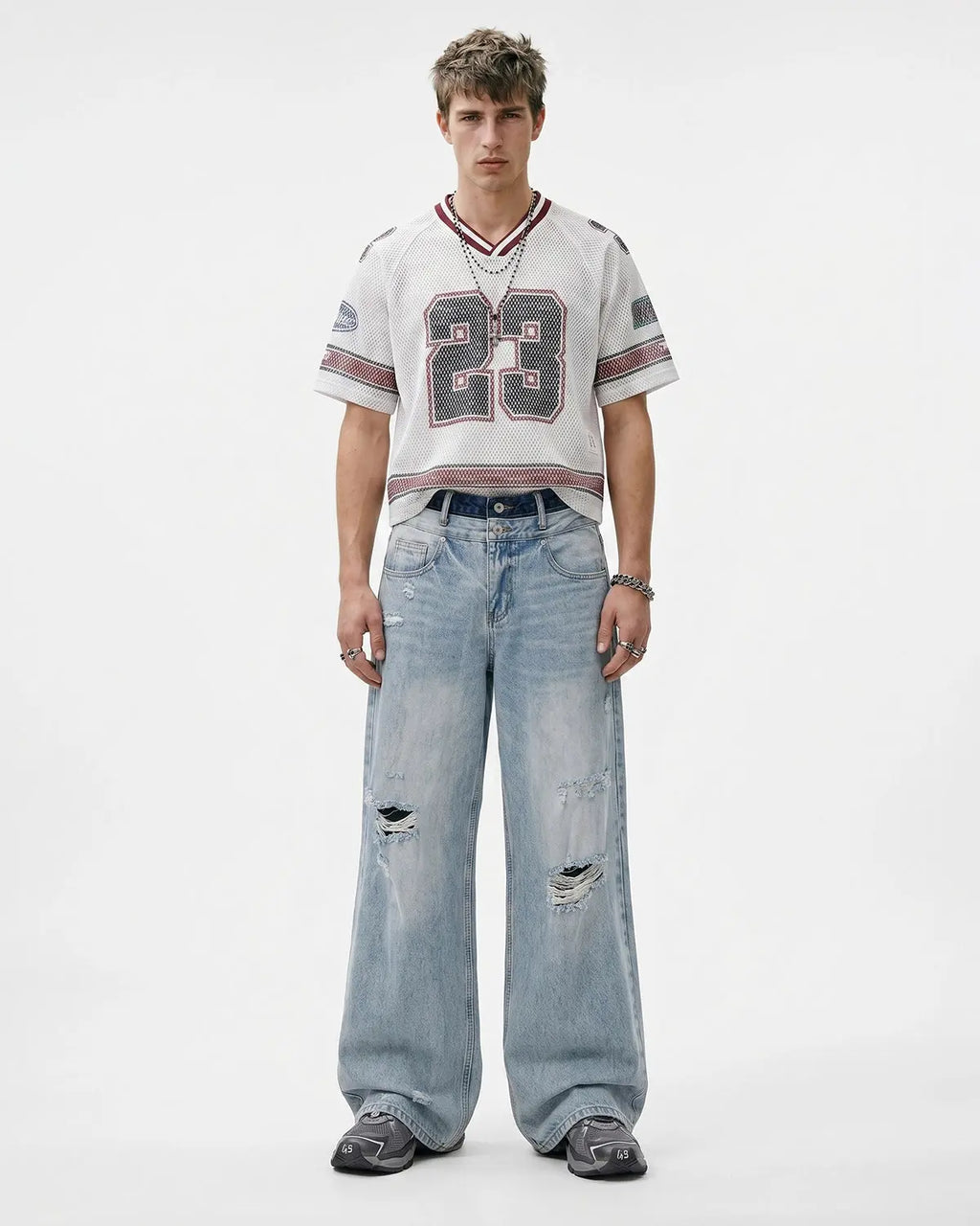 Blue double waist distressed baggy jeans by Flation Streetwear, featuring a relaxed fit and ripped detailing.