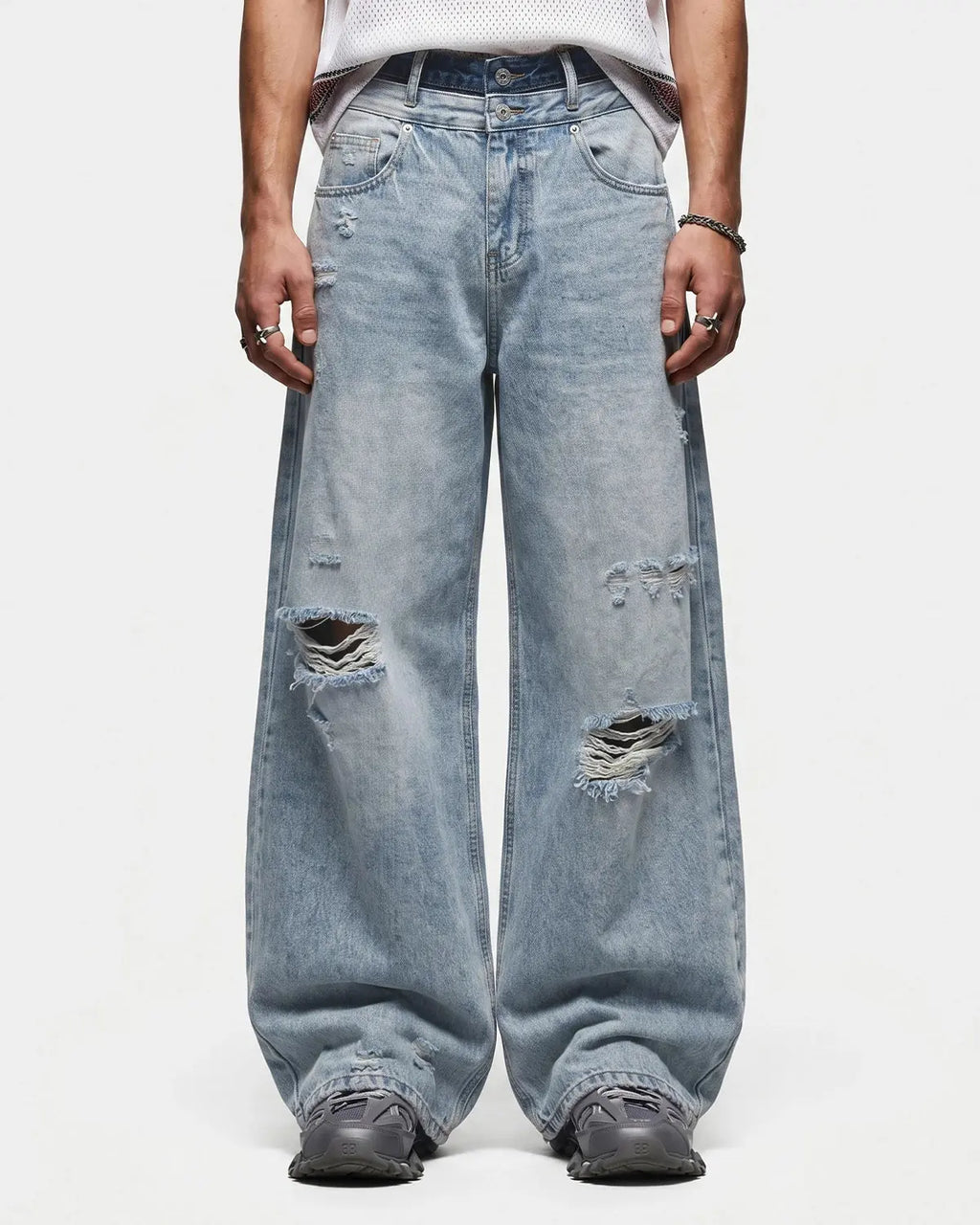 Blue double waist distressed baggy jeans by Flation Streetwear, featuring ripped details and relaxed fit for casual style.