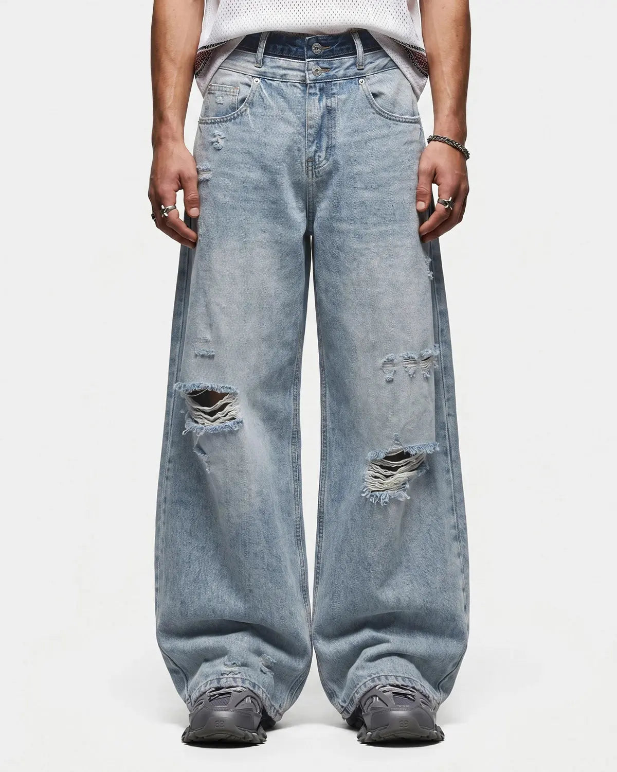 Blue double waist distressed baggy jeans by Flation Streetwear, featuring ripped details and relaxed fit for casual style.