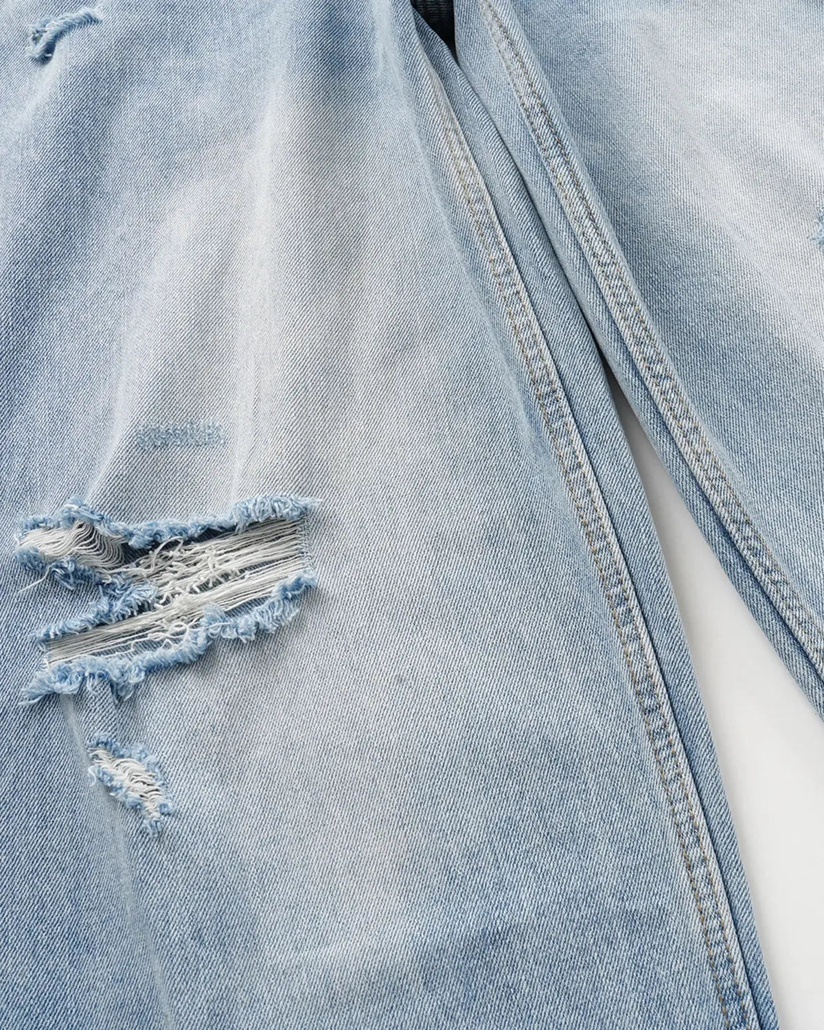 Blue Flation streetwear double waist distressed baggy jeans with ripped details and relaxed fit, casual urban style.