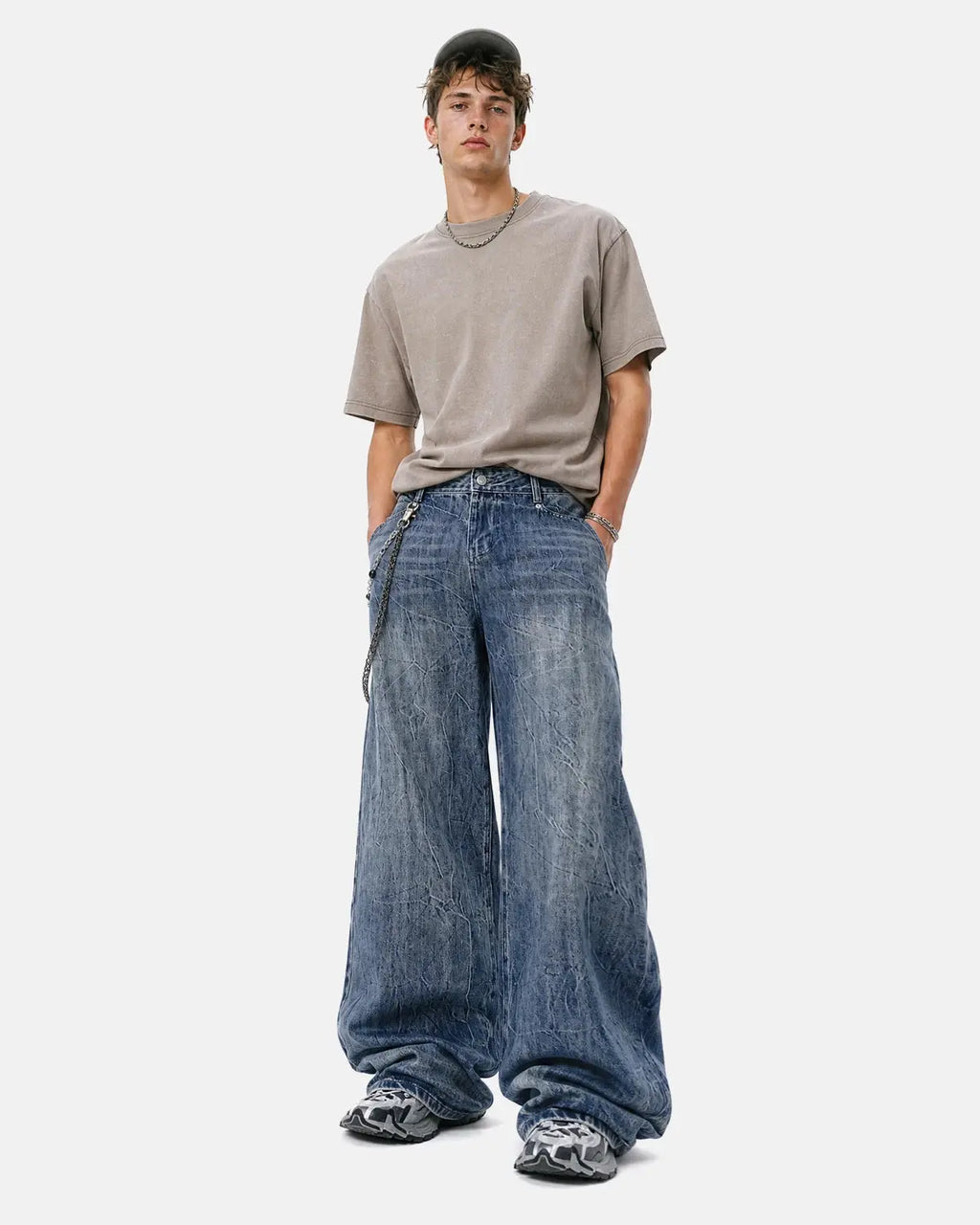 Textured Wash Baggy Jeans by Inflation Streetwear featuring a loose fit and distressed denim fabric.