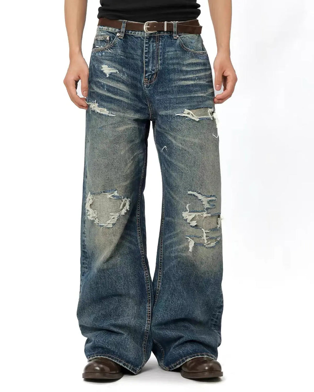 Light blue vintage distressed baggy jeans by Flation Streetwear, showing relaxed fit and worn-in denim texture.