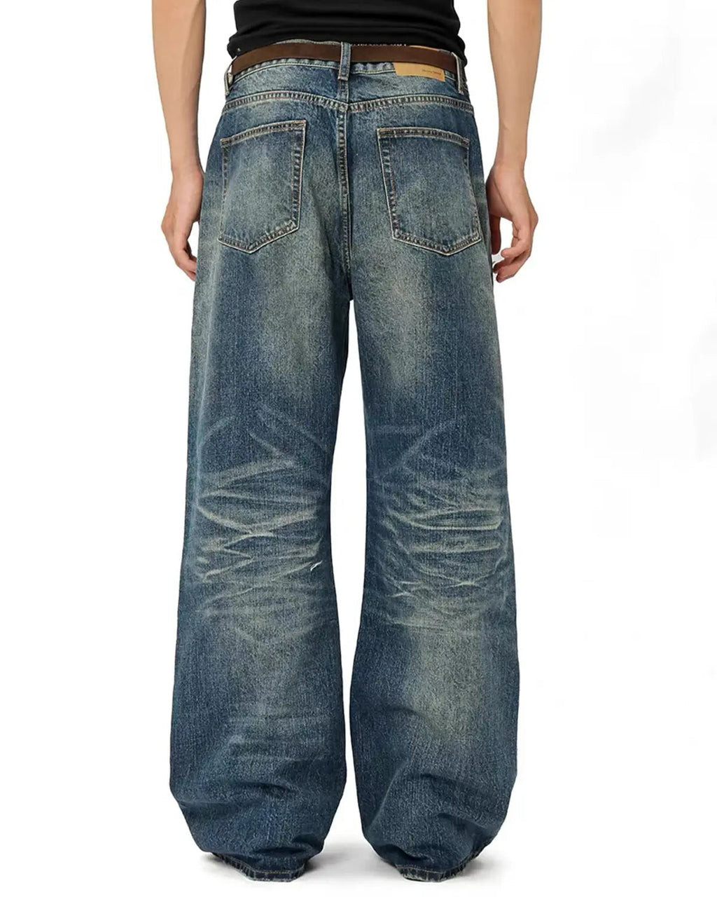 Vintage distressed baggy jeans by Flation Streetwear, featuring a relaxed fit and faded blue denim with stylish worn details.